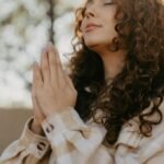 Woman Praying with Hands Clasped