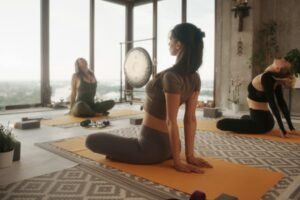 Group of women in sportswear practicing yoga